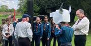 Local Scouts re-enact the procession of the Holy Cross and the bulls that pulled the wagon.