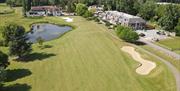 Woolston Manor Golf Course fairway, water and clubhouse