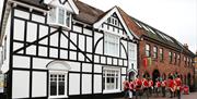 Re-enactors of the Essex Regiment parade outside the museum upon its opening after refurbishment.