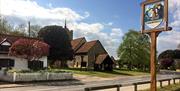 Roydon village sign and church.