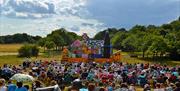 The audience at a performance at The Temple open air theatre in Wanstead Park, Epping Forest