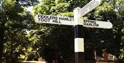 Classic road sign on the green outside the Theydon Oak, Coopersale.