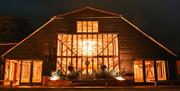 Night view of the Essex Barn wedding venue at Blake Hall Ongar