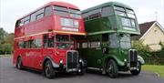 Heritage Buses waiting for passengers outside North Weald Station.