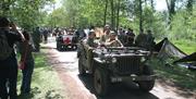 American army re-enactors in jeeps part of VE Day event at Royal Gunpowder Mills Waltham Abbey.