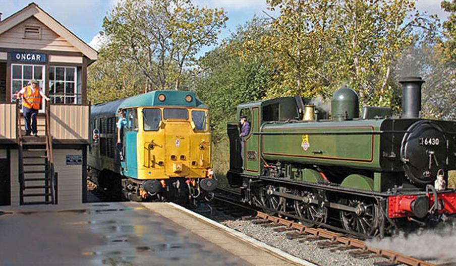 Steam and Diesel stop alongside Ongar Station signal box.