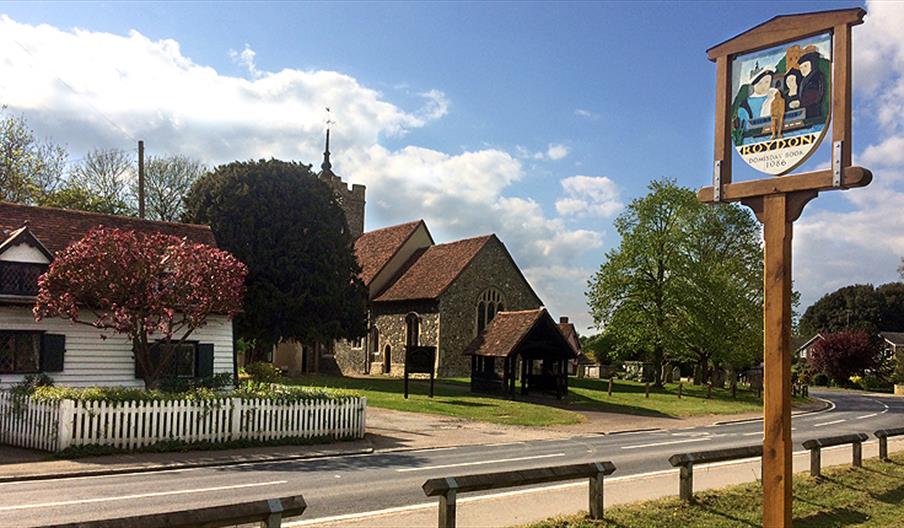 Roydon village sign and church.