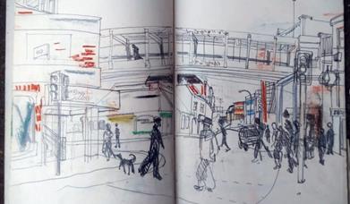 An image of artist Nicola Burrell's sketchbook, a scene of a pedestrian crossing on Queen Street in Colchester