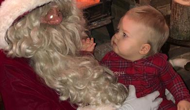 Mr and Mrs Claus invite you into Nevendon Manor