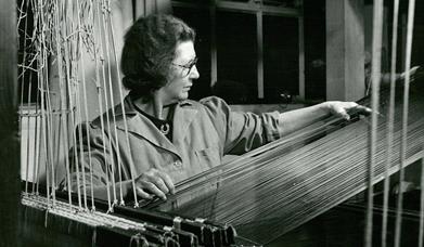 Archive photo of Hilda Carver making purple velvet from Warner Textile Archive