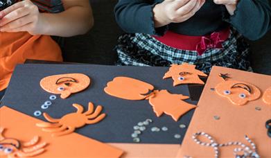 Children doing Halloween crafts