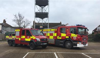 Fire engine and a fire truck with a water tower