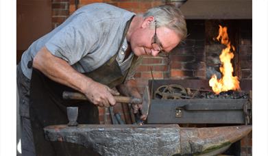 Man working at a forge