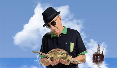 Simon Day is: Dave Angel Eco Warrior Living the Dream Tour