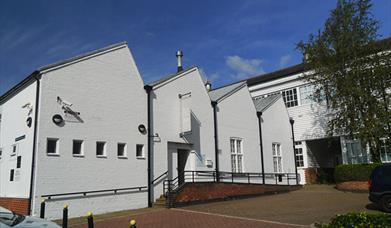 White building with essex weather board which houses Warner Textile Archive in Braintree