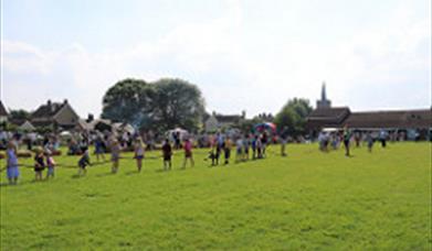 a tug-o-war competition taking place in a field.