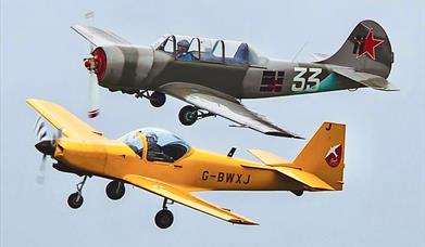 Two vintage planes flying