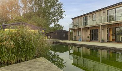 Piglets boutique stay reflected in eco swimming pond
