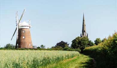 Photo view of church and windmill