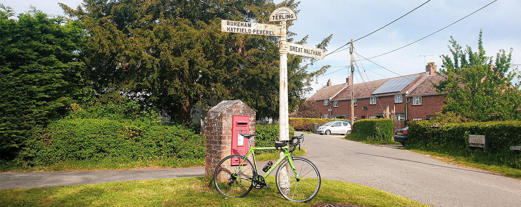 Bicycle propped up against a sign post