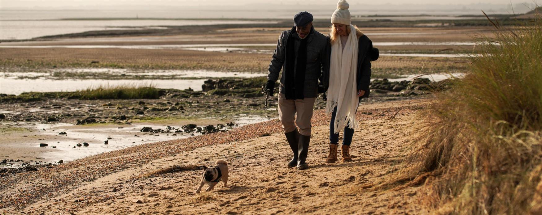 Couple walking on Earlham Beach