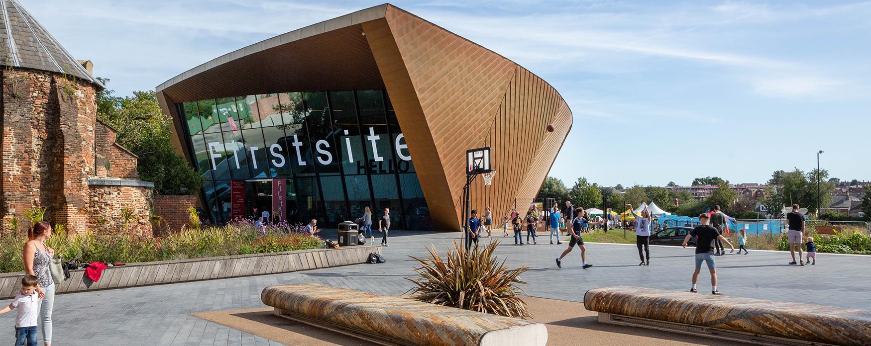 An exterior shot of Firstsite gallery with people in the foreground