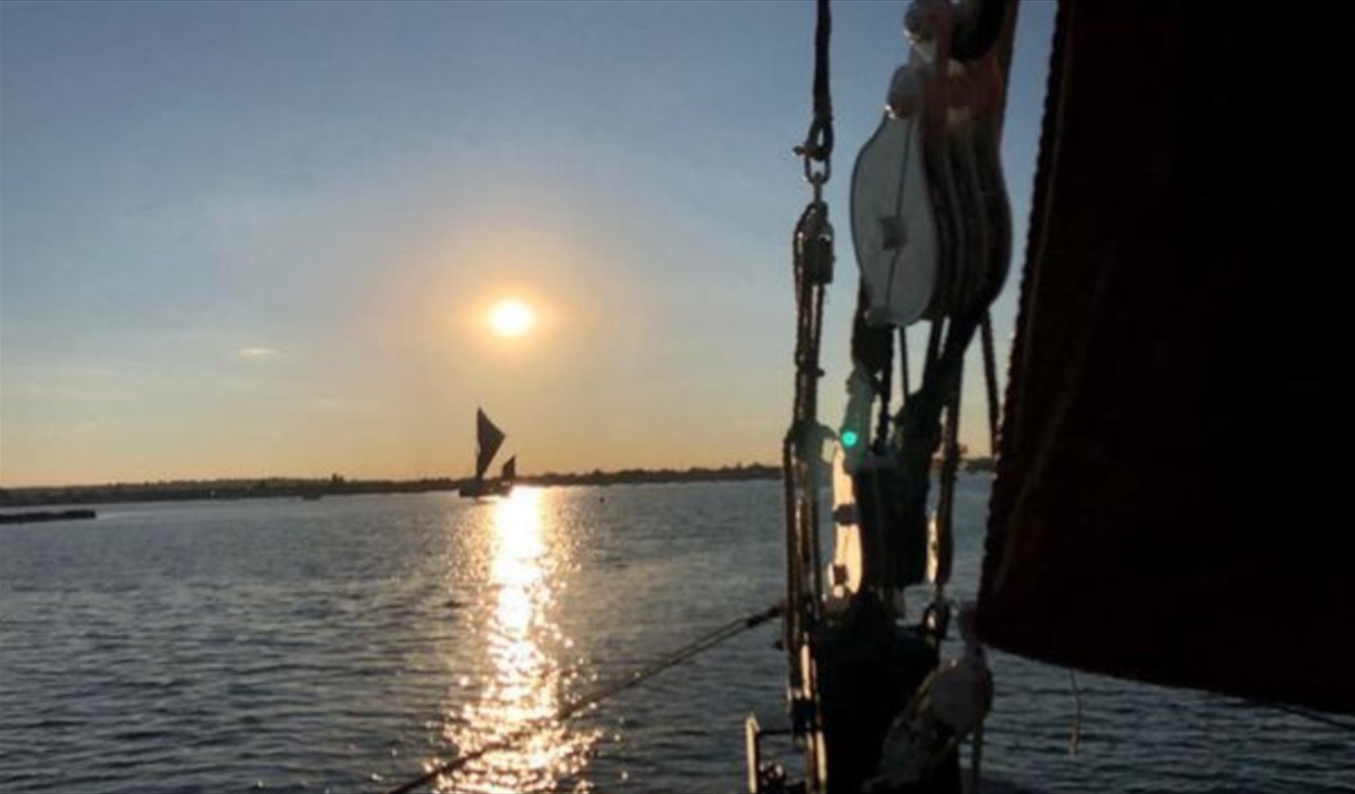 Sunset on the river with Topsail Charters