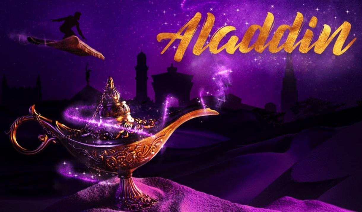 Aladdin rides his magic carpet in the distance, behind a magic lamp
