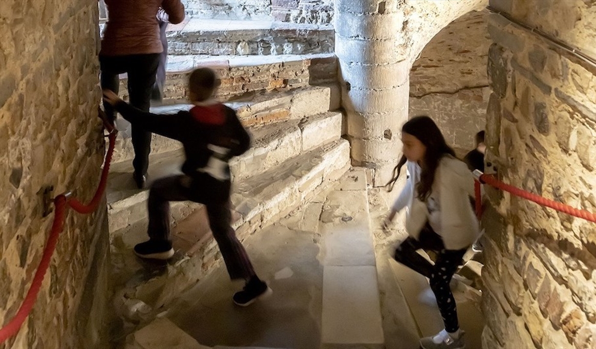 Children climbing the spiral staircase in the Castle