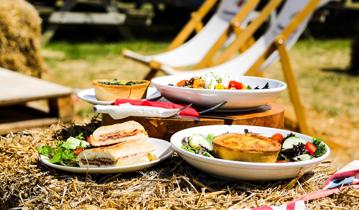 Food on Straw Bales with Deckchairs at Cammas Hall Farm