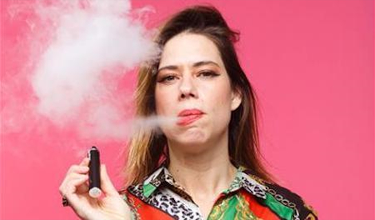 Lou Sanders, smoking a cigar