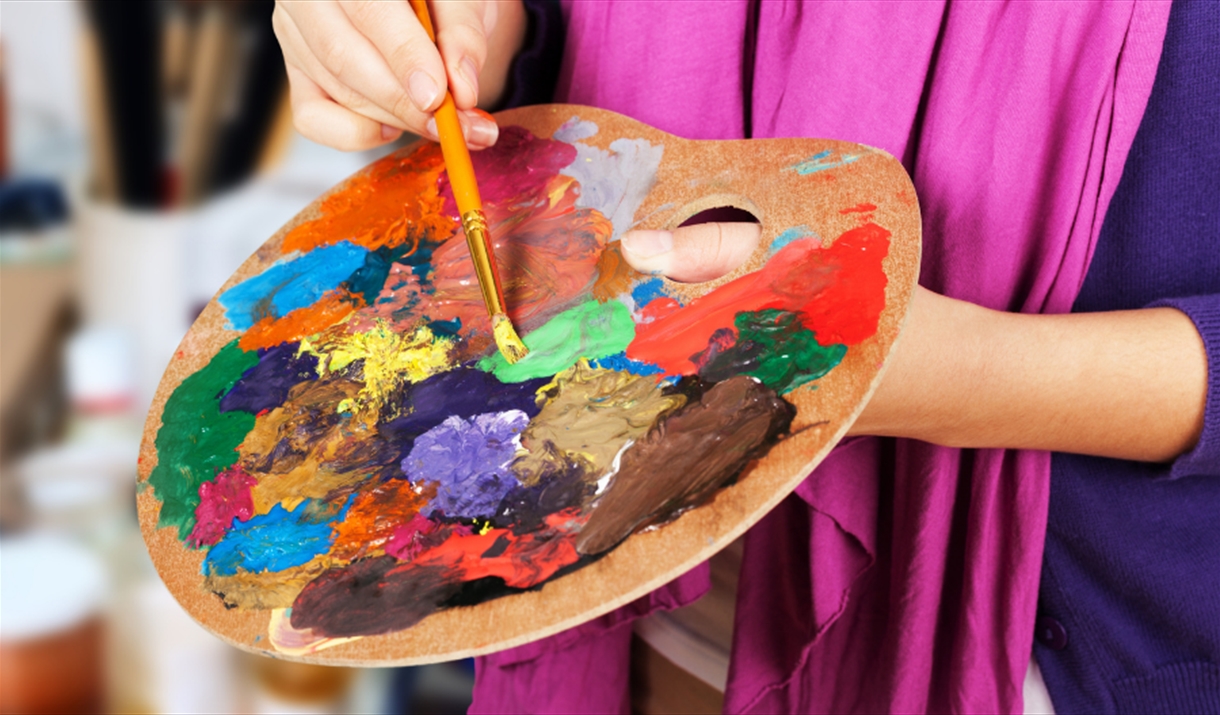 Artist mixing paint