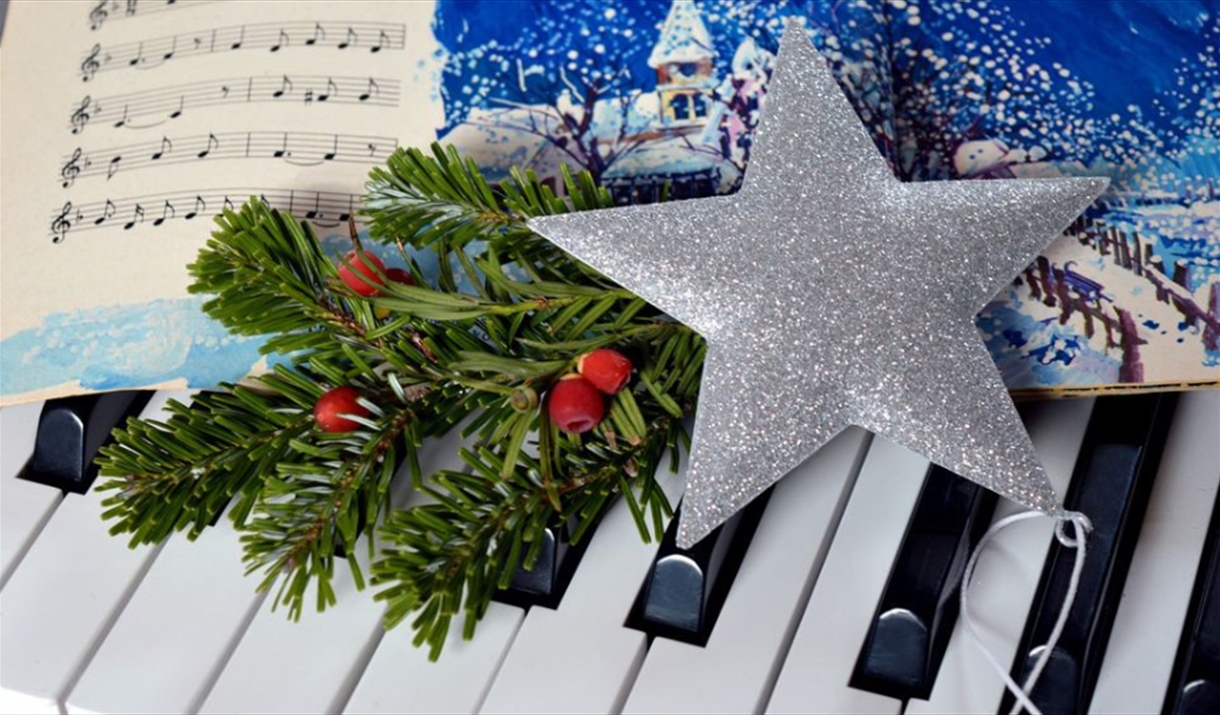 Christmas star on piano keyboard