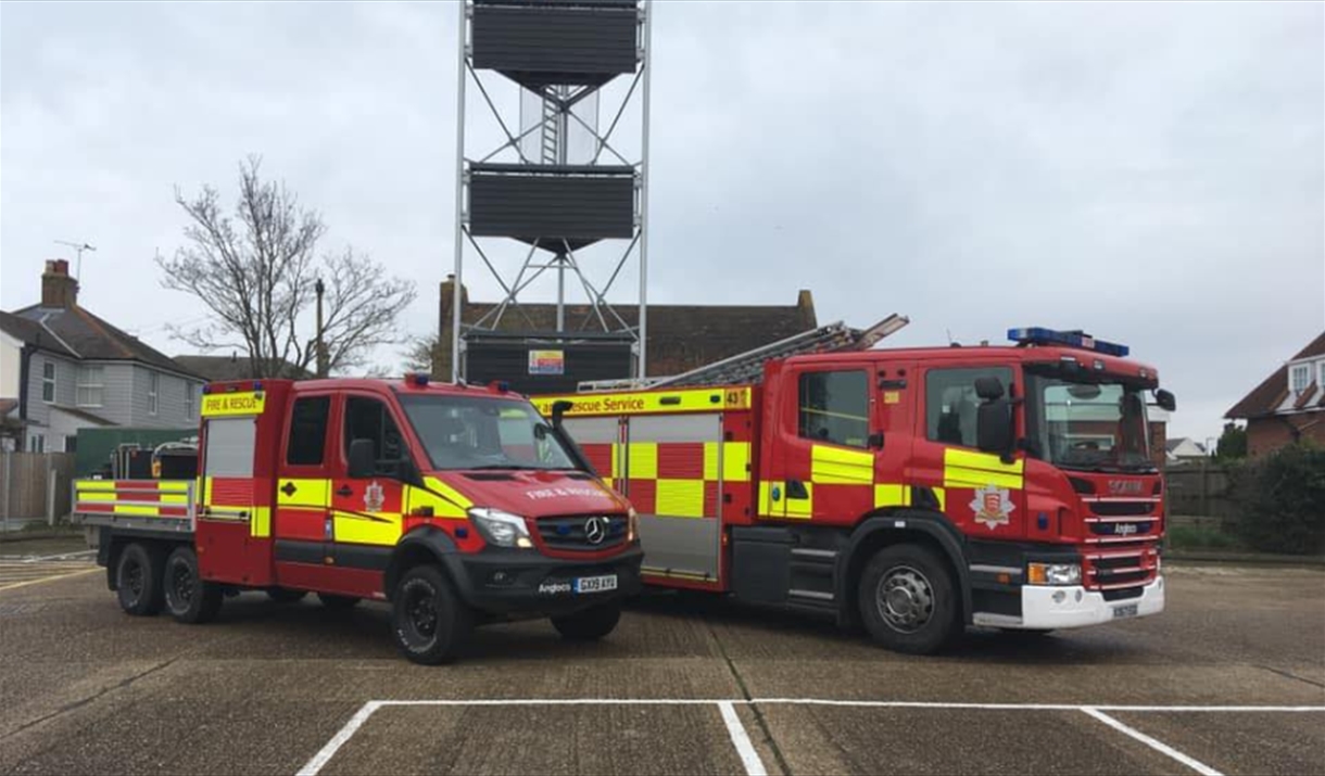 Fire engine and a fire truck with a water tower