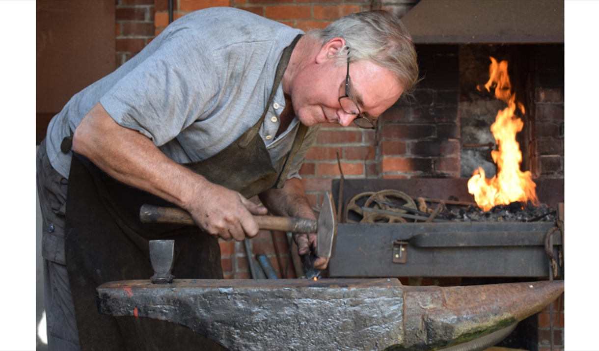 Man working at a forge