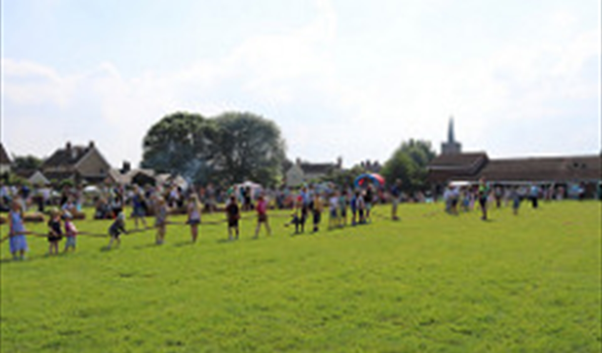 a tug-o-war competition taking place in a field.