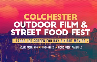 Colchester Outdoor film and street food fest, white writing on a red tinted photograph of castle park