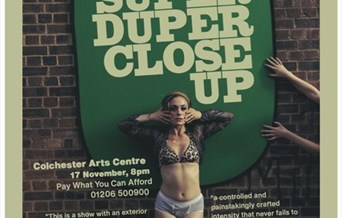 A woman in bra and pants poses for the camera in front of a brick wall. Text advertises the show.