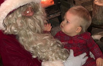 Mr and Mrs Claus invite you into Nevendon Manor