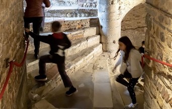 Children climbing the spiral staircase in the Castle