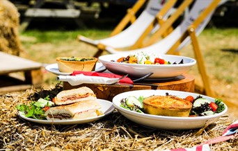 Food on Straw Bales with Deckchairs at Cammas Hall Farm