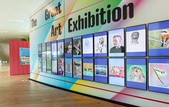 A colourful wall in Firstsite displaying the Great Art Exhibition