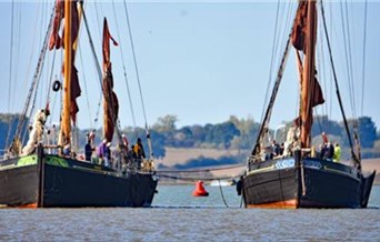 Two Thames Sailing Barges out on the water