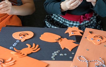 Children doing Halloween crafts