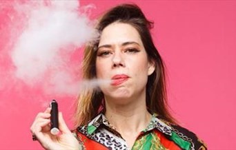 Lou Sanders, smoking a cigar