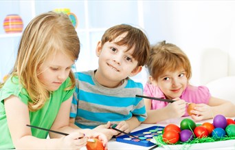 Children decorating Easter eggs