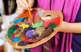 Artist mixing paint