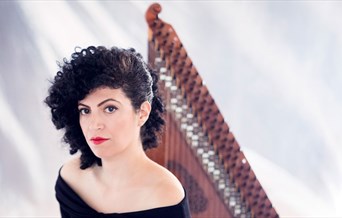 Maya Youssef stands in front of a Qanun