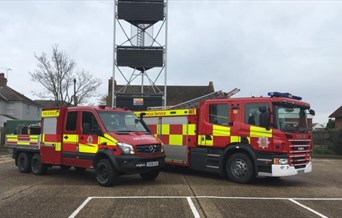 Fire engine and a fire truck with a water tower