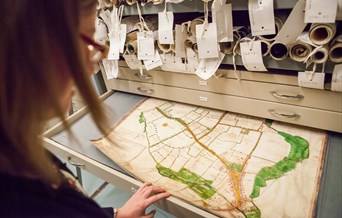 Person viewing the Walker Map of Chelmsford at the Essex Record Office